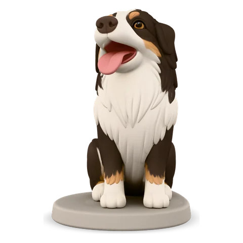 A figurine of a tri-color dog with its tongue out